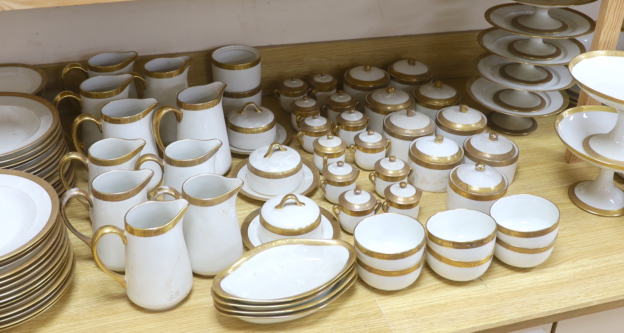 An extensive Limoges dinner and tea, gilt banded service